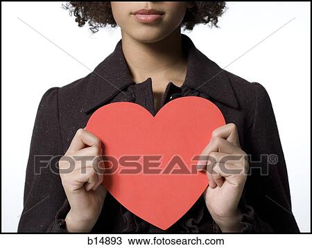 Girl with red heart View Large Photo Image Stock Image - Girl with red heart. Fotosearch