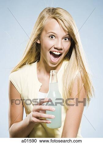 Girl with soda bottle smiling View Large Photo Image Stock Image - Girl with soda bottle smiling. Fotosearch