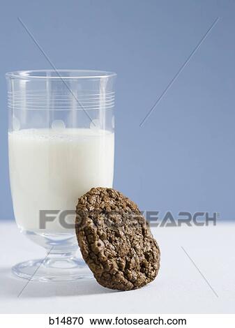 Glass of milk with chocolate cookie View Large Photo Image Stock Image - Glass of milk with chocolate cookie. Fotosearch