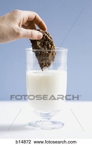 Glass of milk with chocolate cookie View Large Photo Image Stock Image - Glass of milk with chocolate cookie. Fotosearch