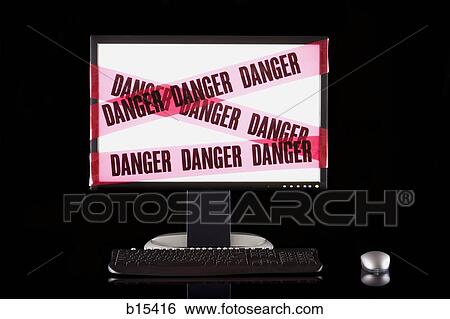 Glowing computer monitor with danger tape View Large Photo Image Stock Photograph - Glowing computer monitor with danger tape. Fotosearch
