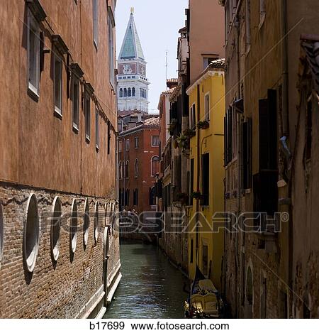 Gondola on canal with historic buildings Venice Italy View Large Photo Image Stock Photo - Gondola on canal with historic buildings Venice Italy. Fotosearch