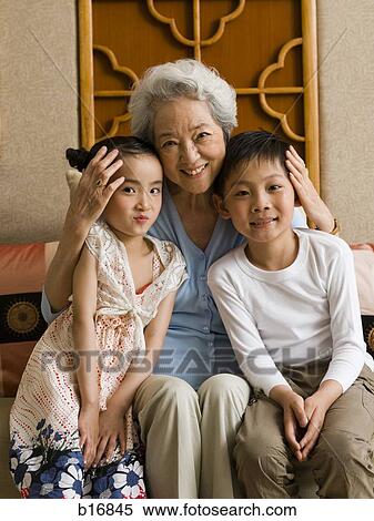 Grandmother with granddaughter and grandson smiling View Large Photo Image Stock Photography - Grandmother with granddaughter and grandson smiling. Fotosearch