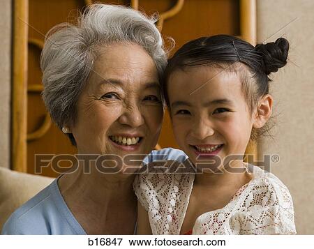 Grandmother with granddaughter smiling View Large Photo Image Stock Photo - Grandmother with granddaughter smiling. Fotosearch