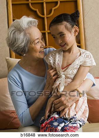 Stock Photo - Grandmother with granddaughter smiling. Fotosearch