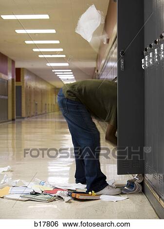 High School student cleaning out his locker. View Large Photo Image Stock Photograph - High School student cleaning out his locker.. Fotosearch