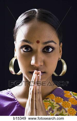 Hindu woman with hands together and bindi View Large Photo Image Stock Photo - Hindu woman with hands together and bindi. Fotosearch