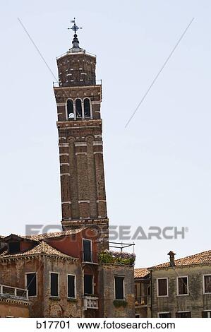 Stock Image - Historic stone tower with weather vane. Fotosearch