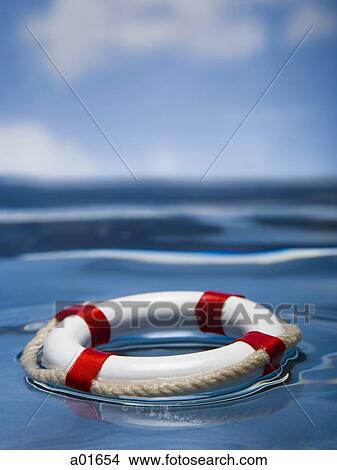 Picture - Life preserver floating in water.. Fotosearch