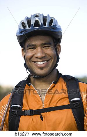 Male cyclist with helmet outdoors smiling View Large Photo Image Stock Photo - Male cyclist with helmet outdoors smiling. Fotosearch