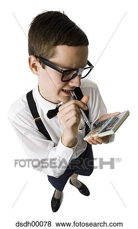Male nerd with suspenders and tape on eyeglasses looking at calculator with pen View Large Photo Image Stock Photo - Male nerd with suspenders and tape on eyeglasses looking at calculator with pen. Fotosearch