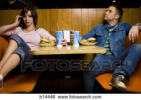 Man and Woman eating View Large Photo Image Stock Photo - Man and Woman eating. Fotosearch