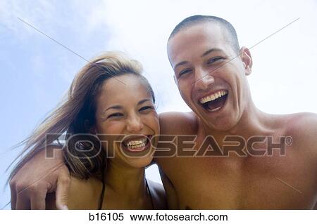 Man and woman hugging and smiling outdoors View Large Photo Image Stock Photography - Man and woman hugging and smiling outdoors. Fotosearch