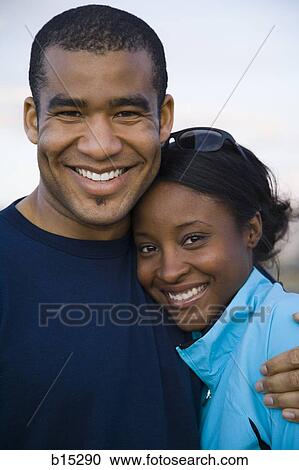 Man and woman hugging outdoors View Large Photo Image Stock Image - Man and woman hugging outdoors. Fotosearch