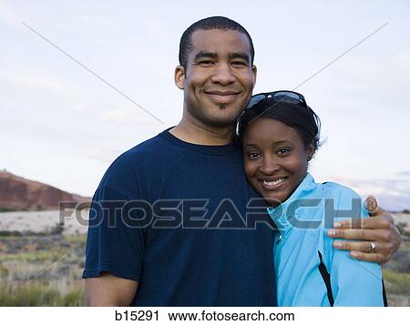 Man and woman hugging outdoors View Large Photo Image Stock Image - Man and woman hugging outdoors. Fotosearch