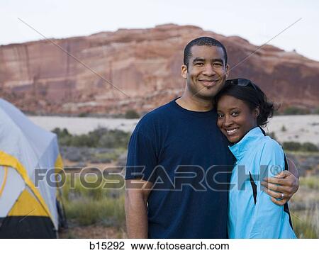 Man and woman hugging outdoors View Large Photo Image Stock Image - Man and woman hugging outdoors. Fotosearch