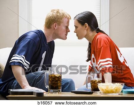 Man and woman on sofa staring at each other angrily View Large Photo Image Stock Photo - Man and woman on sofa staring at each other angrily. Fotosearch
