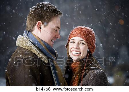 Man and woman outdoors in winter smiling View Large Photo Image Stock Photograph - Man and woman outdoors in winter smiling. Fotosearch