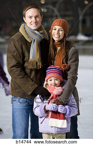 Man and woman with little girl outdoors in winter View Large Photo Image Picture - Man and woman with little girl outdoors in winter. Fotosearch