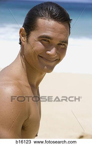 Man at beach smiling View Large Photo Image Stock Image - Man at beach smiling. Fotosearch