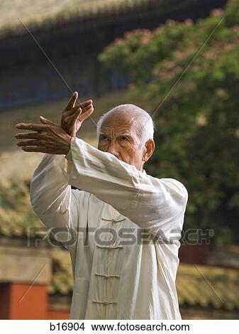 Man doing Kung Fu outdoors View Large Photo Image Picture - Man doing Kung Fu outdoors. Fotosearch