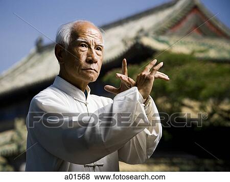 Man doing Kung Fu outdoors View Large Photo Image Stock Photo - Man doing Kung Fu outdoors. Fotosearch