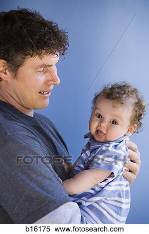 Man holding baby boy View Large Photo Image Stock Photography - Man holding baby boy. Fotosearch