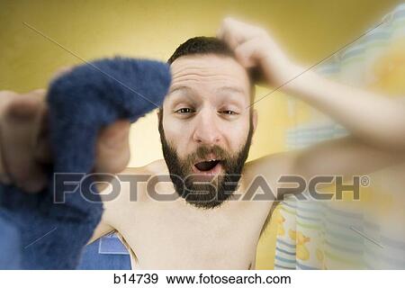 Man in bathroom scratching head and yawning View Large Photo Image Stock Photo - Man in bathroom scratching head and yawning. Fotosearch