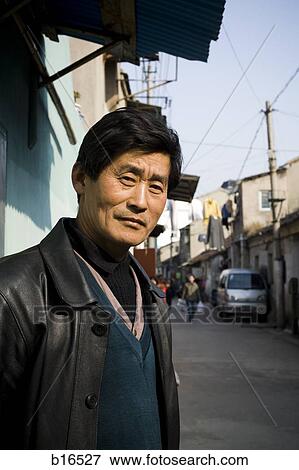 Man outdoors on street in village View Large Photo Image Stock Photo - Man outdoors on street in village. Fotosearch