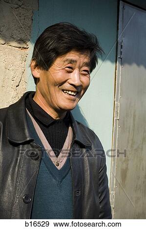 Man outdoors smiling View Large Photo Image Stock Photo - Man outdoors smiling. Fotosearch