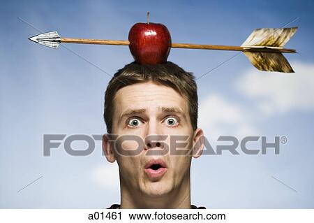 Man outdoors with arrow through red apple on head View Large Photo Image Stock Image - Man outdoors with arrow through red apple on head. Fotosearch