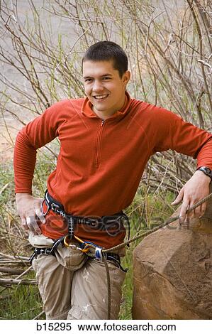Man outdoors with climbing ropes and harness View Large Photo Image Stock Photography - Man outdoors with climbing ropes and harness. Fotosearch