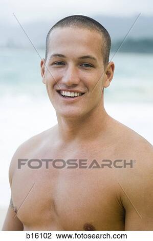 Man standing outdoors smiling View Large Photo Image Stock Image - Man standing outdoors smiling. Fotosearch