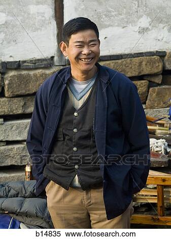 Man standing outdoors smiling View Large Photo Image Stock Photography - Man standing outdoors smiling. Fotosearch