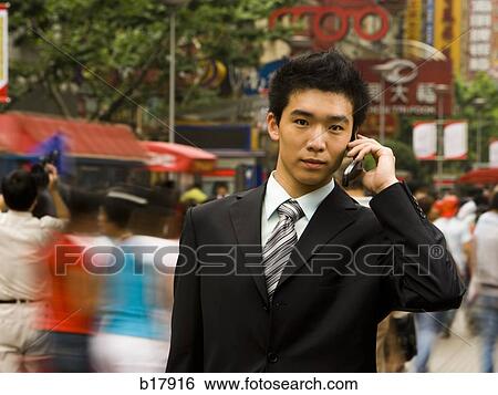 Man with a cell phone. View Large Photo Image Stock Photograph - Man with a cell phone.. Fotosearch