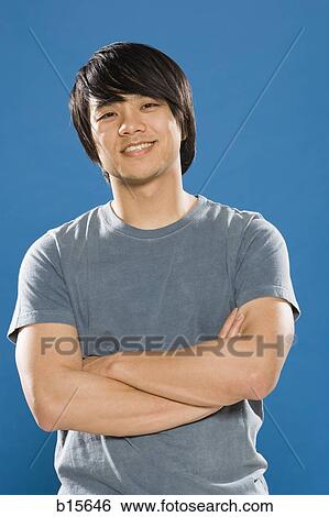 Man with arms crossed smiling View Large Photo Image Stock Photograph - Man with arms crossed smiling. Fotosearch