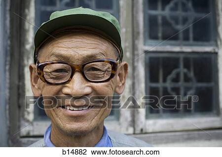 Man with eyeglasses outdoors smiling View Large Photo Image Stock Image - Man with eyeglasses outdoors smiling. Fotosearch