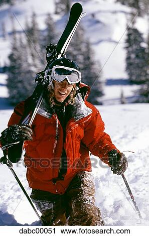 Man with skis and poles outdoors in winter View Large Photo Image Stock Image - Man with skis and poles outdoors in winter. Fotosearch