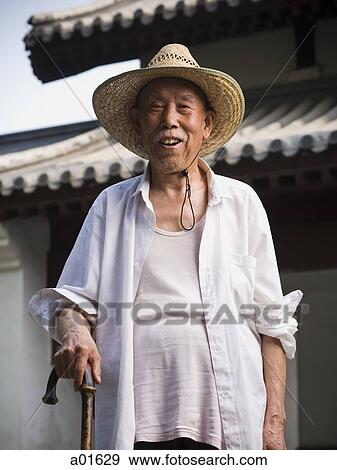 Man with straw hat and cane smiling View Large Photo Image Stock Photo - Man with straw hat and cane smiling. Fotosearch