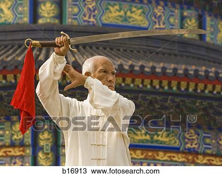 Man with sword outdoors View Large Photo Image Stock Image - Man with sword outdoors. Fotosearch