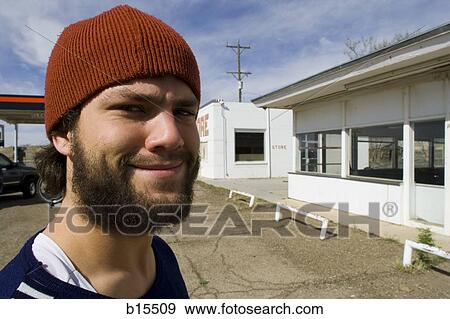 Stock Photo - Man with toque and beard outdoors smiling. Fotosearch