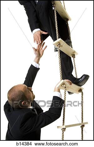 Men climbing up a ladder. View Large Photo Image Picture - Men climbing up a ladder.. Fotosearch
