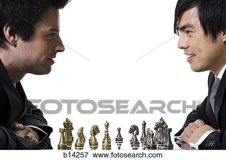 Stock Photo - Men playing chess. Fotosearch