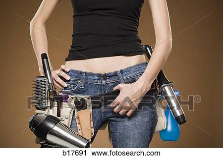 Mid section view of hairdresser with tool belt View Large Photo Image Stock Image - Mid section view of hairdresser with tool belt. Fotosearch