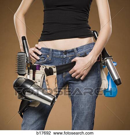 Mid section view of hairdresser with tool belt View Large Photo Image Stock Image - Mid section view of hairdresser with tool belt. Fotosearch