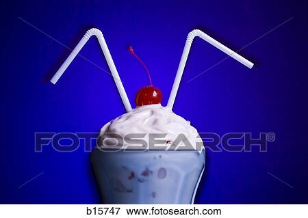 Milkshake with two straws and maraschino cherry View Large Photo Image Stock Photo - Milkshake with two straws and maraschino cherry. Fotosearch
