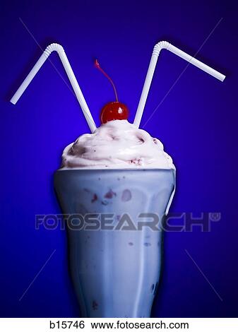 Milkshake with two straws and maraschino cherry View Large Photo Image Stock Photograph - Milkshake with two straws and maraschino cherry. Fotosearch