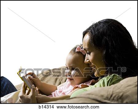 Mother and daughter reading. View Large Photo Image Picture - Mother and daughter reading.. Fotosearch
