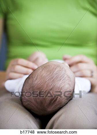 Stock Photo - Mother holding baby. Fotosearch