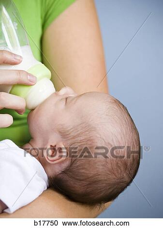Mother holding Newborn baby. View Large Photo Image Stock Image - Mother holding Newborn baby.. Fotosearch